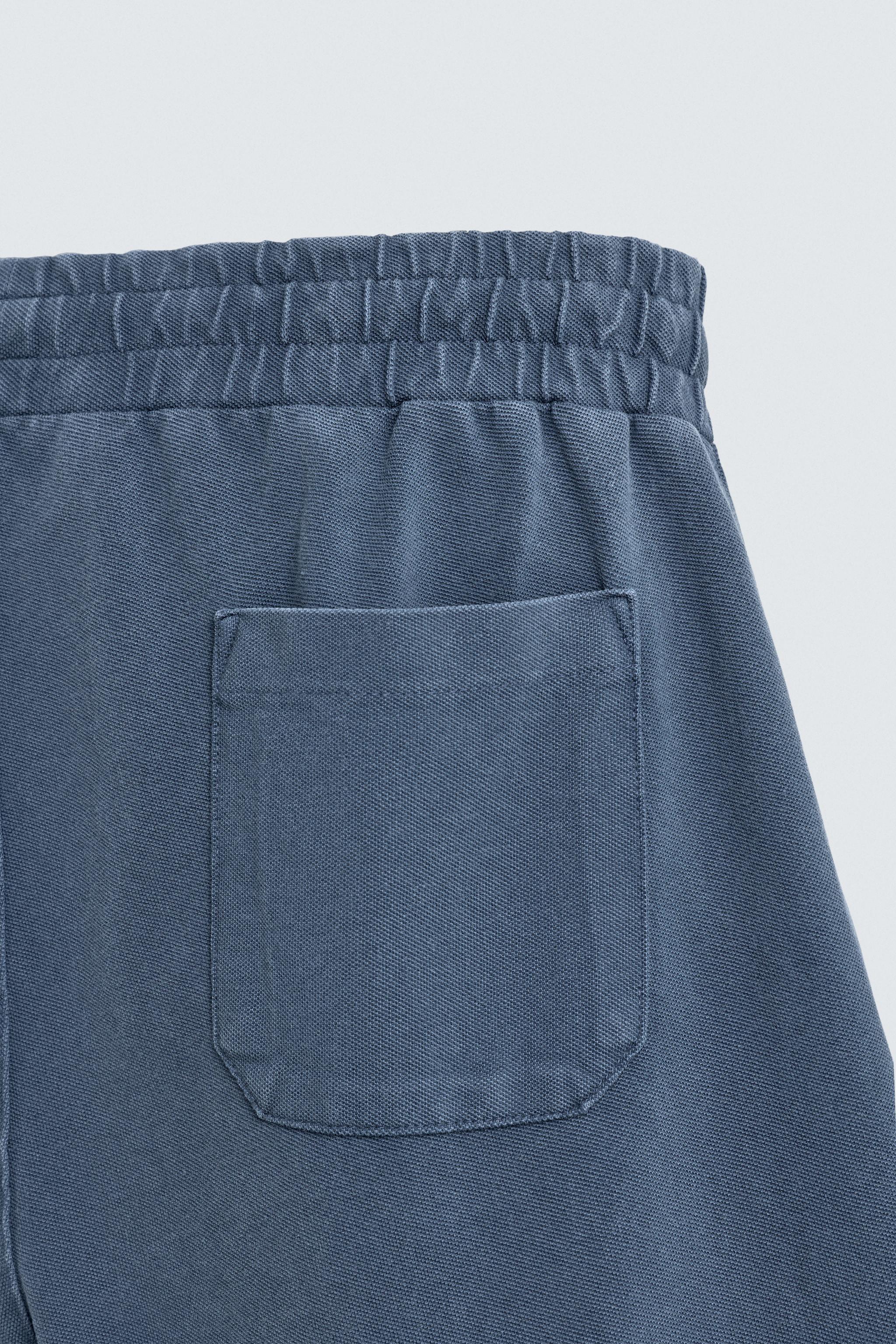BERMUDA EN PIQUÉ REGULAR FIT DÉLAVÉ